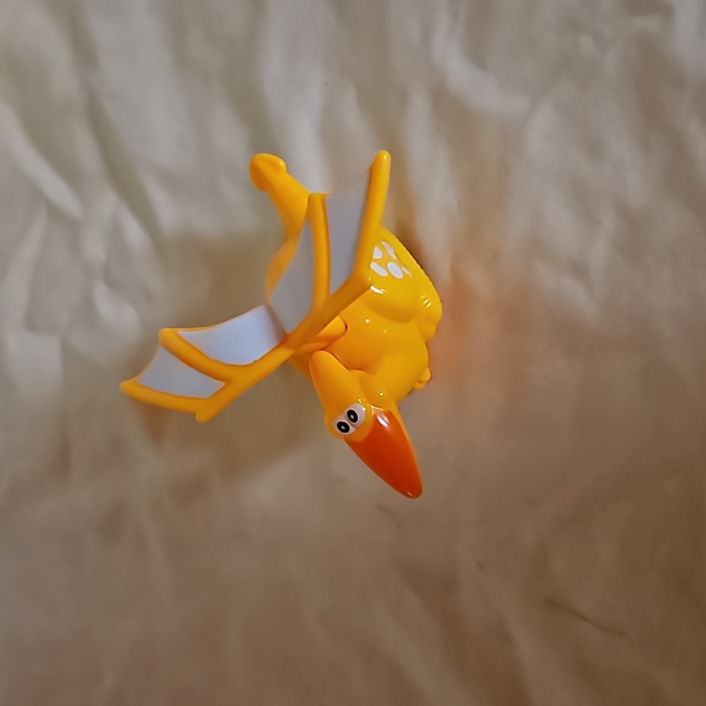 Dinosaur pull back wheel toy
